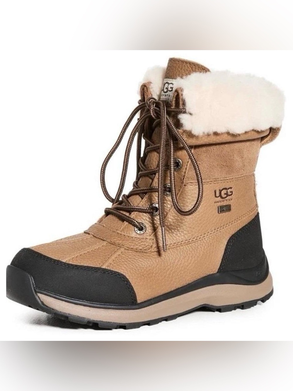 UGG Adirondack III snow boots featuring a cream fleece lining and lace-up front.